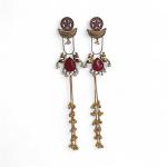 Elegant handcrafted earrings with red stones